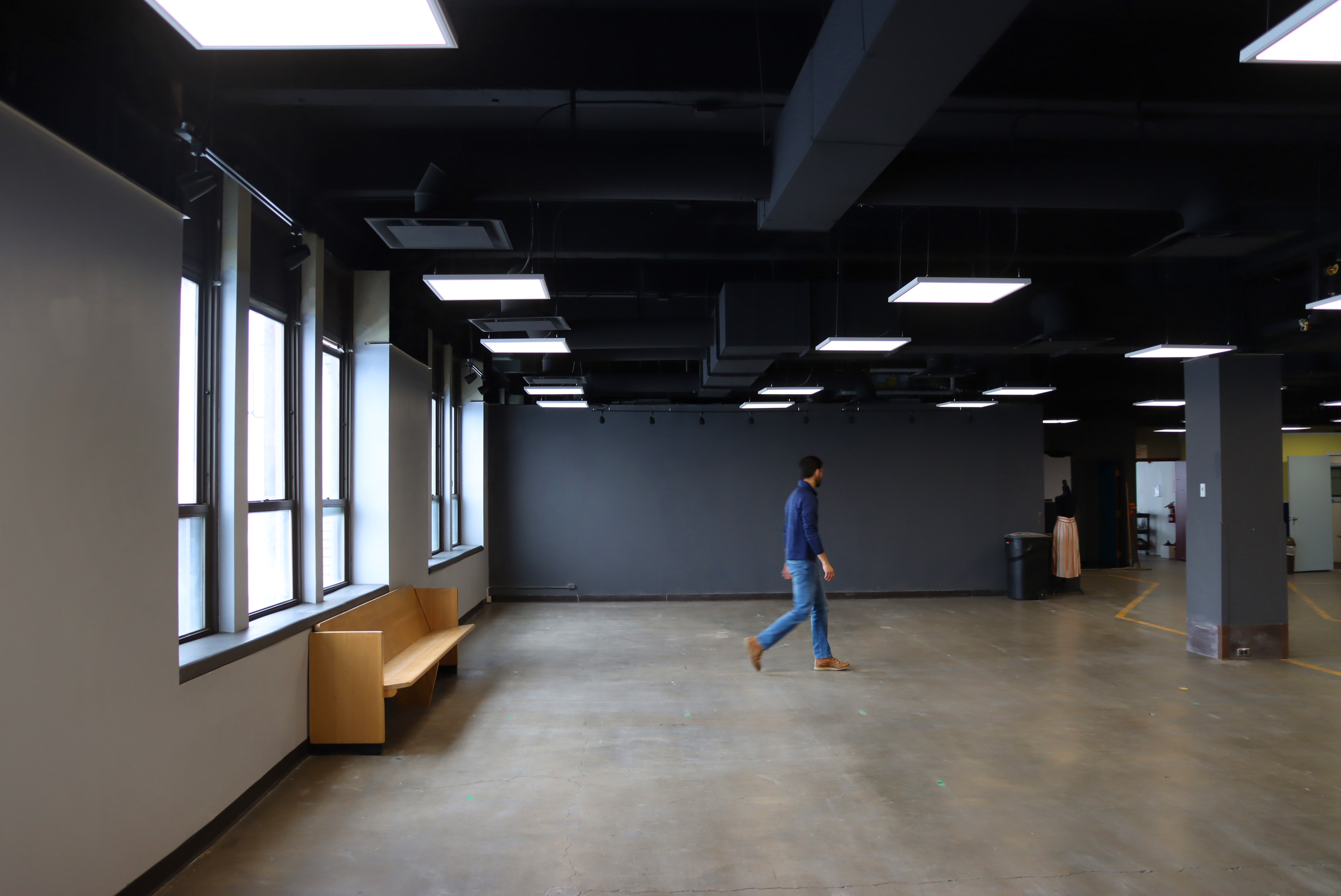 Person walking across studio area 