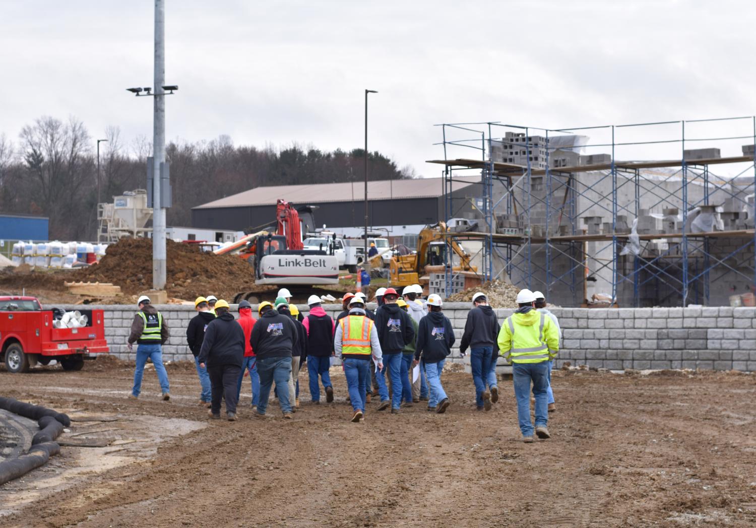 Four Cities Compact Carpentry students touring with Summit Construction
